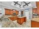 Gourmet kitchen featuring granite countertops, stainless steel appliances, and custom cabinets with a central island at 15208 21St E Ave, Bradenton, FL 34212