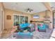 Covered patio with outdoor kitchen, grill, and ample seating, perfect for entertaining at 15208 21St E Ave, Bradenton, FL 34212