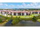 Waterfront condo building surrounded by green lawns and waterways at 1608 Stickney Point Rd # 304, Sarasota, FL 34231