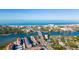An aerial view shows the island community with easy access to the beach with restaurants, shops, and condominiums at 1608 Stickney Point Rd # 304, Sarasota, FL 34231