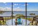 Breakfast nook on balcony overlooking the water at 1608 Stickney Point Rd # 304, Sarasota, FL 34231
