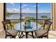 Cozy breakfast nook on balcony with breathtaking water view at 1608 Stickney Point Rd # 304, Sarasota, FL 34231