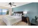 Bedroom with water view, side tables, and lamps at 1608 Stickney Point Rd # 304, Sarasota, FL 34231