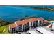 Condo building with covered parking and water views at 1608 Stickney Point Rd # 304, Sarasota, FL 34231
