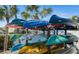 Kayak storage with stacked colorful kayaks and waterfront views at 1608 Stickney Point Rd # 304, Sarasota, FL 34231