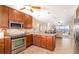 Kitchen with stainless appliances, granite countertops, and view to living room at 1608 Stickney Point Rd # 304, Sarasota, FL 34231