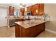 Kitchen with stainless appliances, granite countertops, and pendant lighting at 1608 Stickney Point Rd # 304, Sarasota, FL 34231