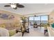 Living room with a serene view of the bay at 1608 Stickney Point Rd # 304, Sarasota, FL 34231