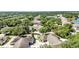 Overhead shot of a residential community with tree-lined streets, and a peaceful atmosphere at 1651 Red Oak Ln, Port Charlotte, FL 33948