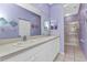 A full bathroom features a double sink vanity, mirrored medicine cabinet, and tiled shower with glass door at 1651 Red Oak Ln, Port Charlotte, FL 33948