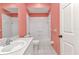 A cozy bathroom features a single sink vanity, mirrored medicine cabinet, and shower over tub at 1651 Red Oak Ln, Port Charlotte, FL 33948