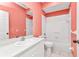 A full bathroom features a single sink vanity, mirrored medicine cabinet, and shower over tub at 1651 Red Oak Ln, Port Charlotte, FL 33948