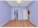 Bedroom featuring hardwood floors, ensuite bathroom, and a closet at 1651 Red Oak Ln, Port Charlotte, FL 33948