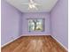 Bedroom featuring hardwood floors and a window offering ample natural light at 1651 Red Oak Ln, Port Charlotte, FL 33948