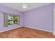 Bedroom with hardwood floors, a window, and neutral paint colors at 1651 Red Oak Ln, Port Charlotte, FL 33948