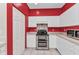 Bright kitchen features white cabinets, stainless steel appliances, and tile backsplash at 1651 Red Oak Ln, Port Charlotte, FL 33948