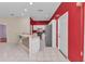 Bright kitchen boasts white cabinets, stainless steel appliances, and a breakfast bar with decorative backsplash at 1651 Red Oak Ln, Port Charlotte, FL 33948