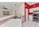 Bright kitchen boasts stainless steel sink, white cabinets, and adjacent breakfast bar at 1651 Red Oak Ln, Port Charlotte, FL 33948
