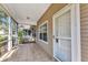 Cozy screened-in porch with tile flooring, perfect for enjoying the outdoors in comfort at 1651 Red Oak Ln, Port Charlotte, FL 33948