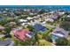 Beautiful aerial view of a coastal neighborhood with lush landscaping and stunning waterfront homes at 180 Lookout Point Dr, Osprey, FL 34229