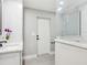Bathroom featuring double vanity, quartz countertop, and a frameless glass shower at 180 Lookout Point Dr, Osprey, FL 34229