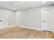 Spacious, bright bedroom with hardwood flooring, neutral walls and multiple closets for storage at 180 Lookout Point Dr, Osprey, FL 34229