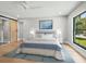 Comfortable bedroom features a serene color scheme, large window, and stylish furnishings at 180 Lookout Point Dr, Osprey, FL 34229