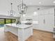 Beautiful kitchen featuring double islands, stainless appliances, and backyard pool access at 180 Lookout Point Dr, Osprey, FL 34229
