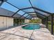A luxurious pool with a screened enclosure offers private relaxation and recreation at 180 Lookout Point Dr, Osprey, FL 34229