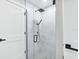 Modern shower with marble tile and sleek fixtures at 180 Lookout Point Dr, Osprey, FL 34229