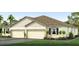 Charming single-story home boasting a two-car garage and well-manicured lawn at 18109 Cropside Trl, Lakewood Ranch, FL 34211