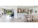 Open concept living and dining area with view to kitchen and backyard at 18109 Cropside Trl, Lakewood Ranch, FL 34211