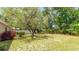 Spacious backyard with mature trees at 2110 Craft Ln, Sarasota, FL 34239