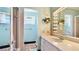 This is a retro bathroom with mosaic tile accent and a sink with cabinet at 2110 Craft Ln, Sarasota, FL 34239