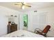 Bedroom with a ceiling fan, closet, and cozy seating at 2110 Craft Ln, Sarasota, FL 34239