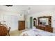 Traditional bedroom featuring a ceiling fan, a closet, and a vanity at 2110 Craft Ln, Sarasota, FL 34239