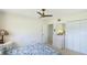 Neutral bedroom featuring a dresser, closet, and lots of natural light at 2110 Craft Ln, Sarasota, FL 34239