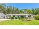 Charming single-story home with well-maintained lawn and mature trees at 2110 Craft Ln, Sarasota, FL 34239