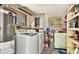 Laundry room area equipped with a washer, dryer, and utility sink at 2110 Craft Ln, Sarasota, FL 34239