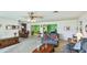 Open-concept living room flowing into the dining area with comfortable seating at 2110 Craft Ln, Sarasota, FL 34239