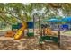 Playground with slides and climbing area, featuring shade trees at 2110 Craft Ln, Sarasota, FL 34239