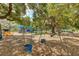 A playground featuring swings and slides set in a shaded, tree-filled park at 2110 Craft Ln, Sarasota, FL 34239