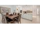 Bright dining room featuring a wood table set with seating near the modern kitchen at 2135 Hyde Park St, Sarasota, FL 34239