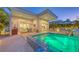 Modern exterior with patio area, hot tub, outdoor dining and lush landscaping creating an inviting backyard retreat at 2135 Hyde Park St, Sarasota, FL 34239