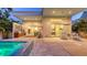Beautiful backyard exterior with hot tub, patio, lounge chairs, and access to interior living space at 2135 Hyde Park St, Sarasota, FL 34239