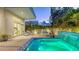 Gorgeous outdoor patio with a modern mosaic tiled hot tub and water feature and a dining area at 2135 Hyde Park St, Sarasota, FL 34239