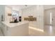 Sleek white kitchen with modern appliances, mosaic backsplash, and ample counter space at 2135 Hyde Park St, Sarasota, FL 34239