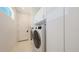 Laundry room with a washer, dryer, and plenty of storage space at 2135 Hyde Park St, Sarasota, FL 34239