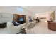 Bright, open-concept living room with high ceilings and seamless flow into the modern kitchen and dining area at 2135 Hyde Park St, Sarasota, FL 34239