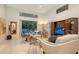 Open living room with tile flooring, comfortable seating, and sliding doors opening to the pool area at 2135 Hyde Park St, Sarasota, FL 34239